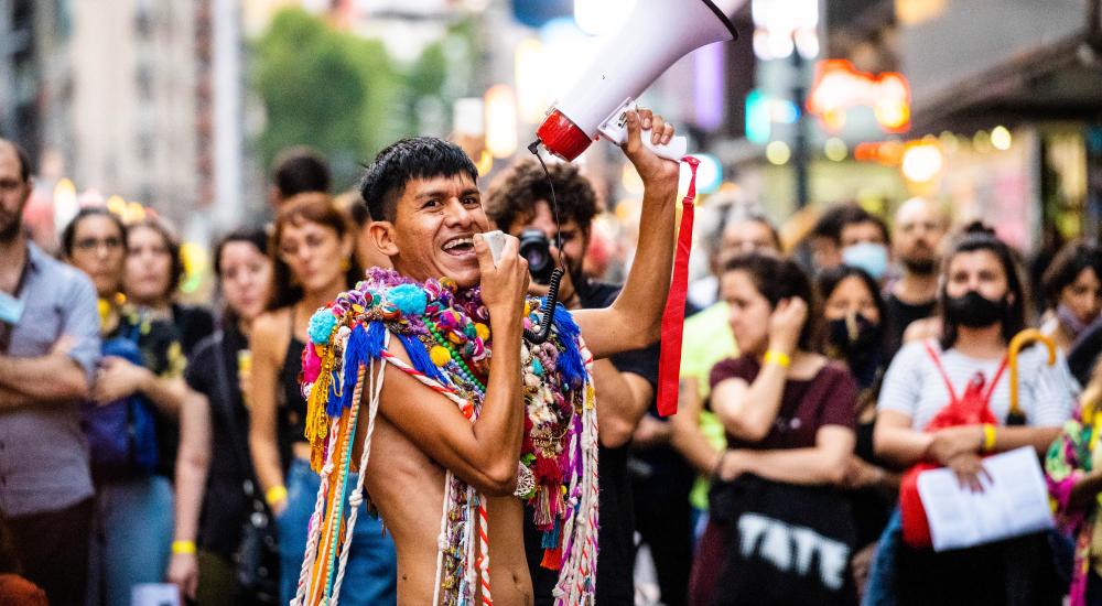 Smiling person with a megaphone