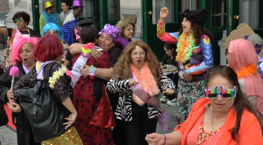 A group of domestic workers dressed in carnivalesque clothing
