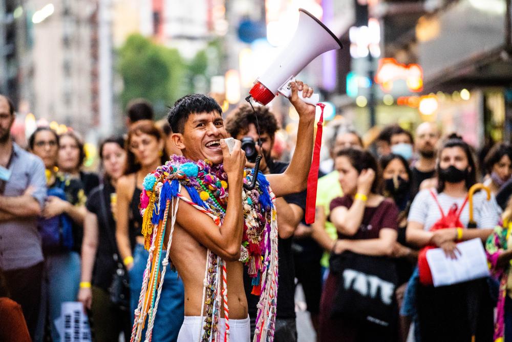 Smiling person with a megaphone