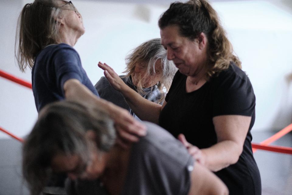 4 dancers mid-movement