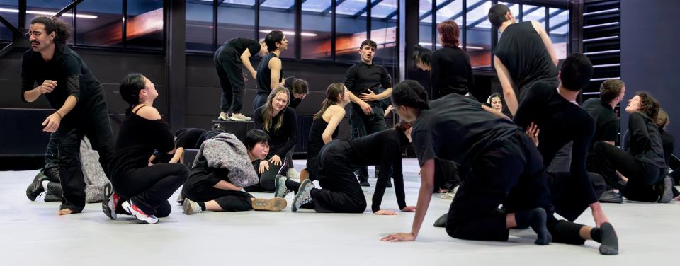 Group of performers wearing black