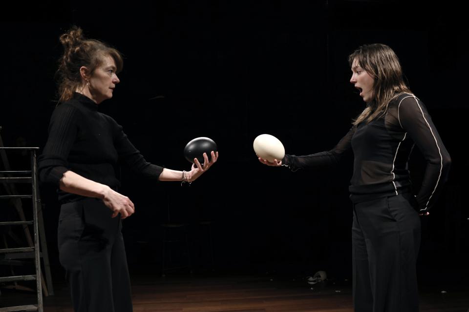 Two women looking at eggs