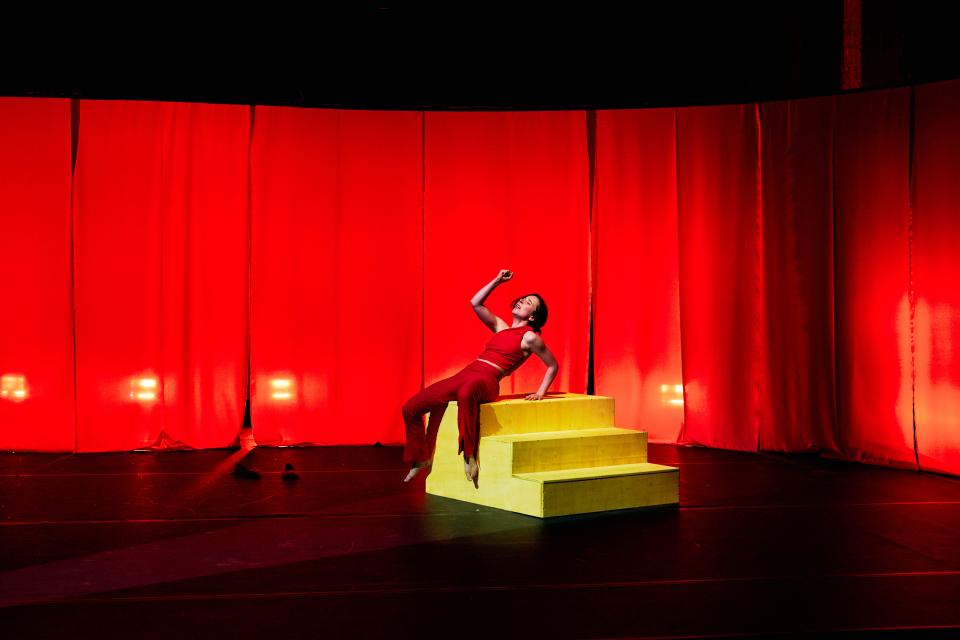 one performer sitting on yellow stairs
