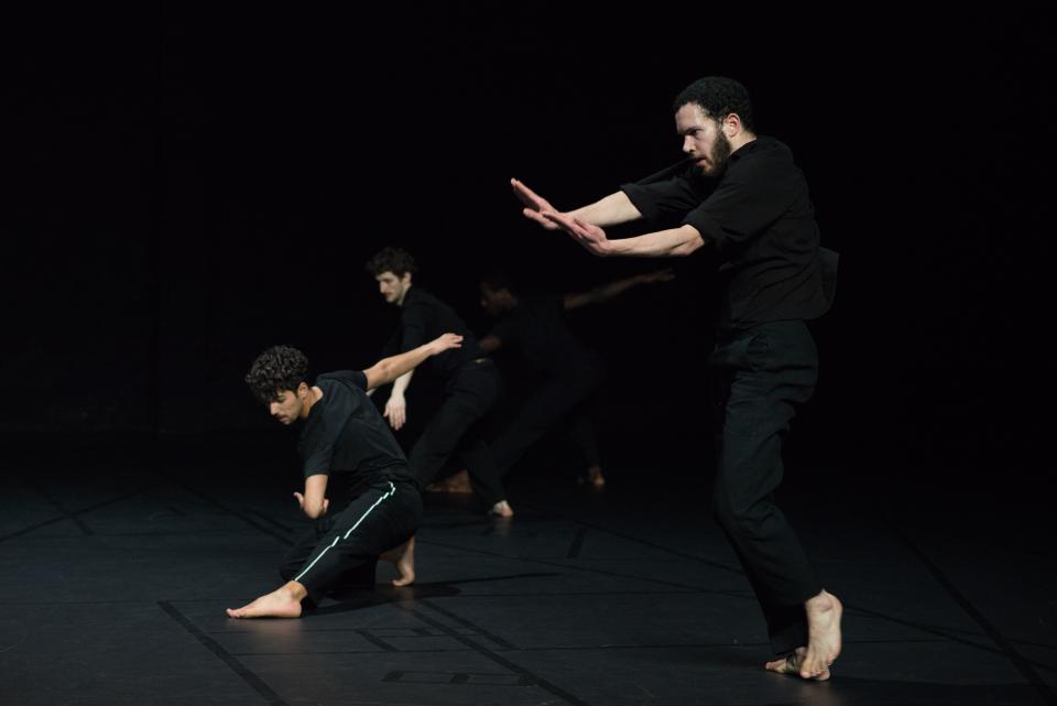 3 male dancers wearing black clothes