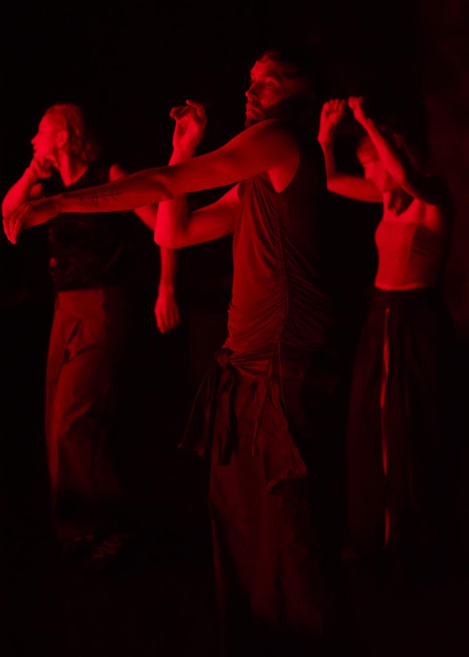 3 performers in a circle